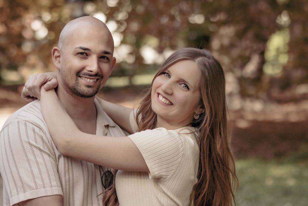 A couple laughs as they embrace in the Villa dei Cedri park in Bellinzona