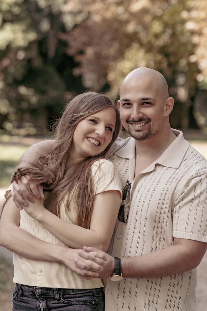 A couple laughs as they embrace in the Villa dei Cedri park in Bellinzona