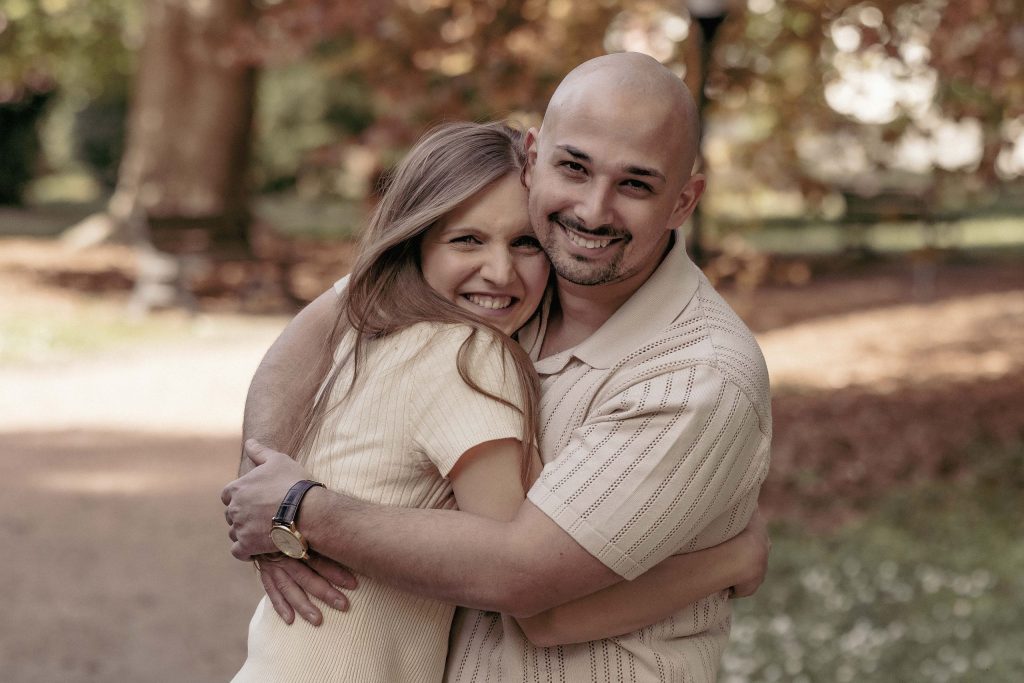 A couple laughs as they embrace in the Villa dei Cedri park in Bellinzona