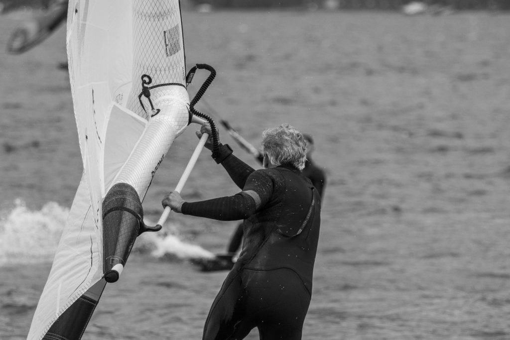 A man is wingfoiling on Lago di Como in Italy