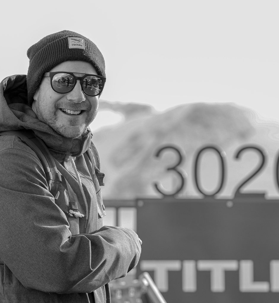 A man poses in the snowy mountains on Titlis, Egelberg