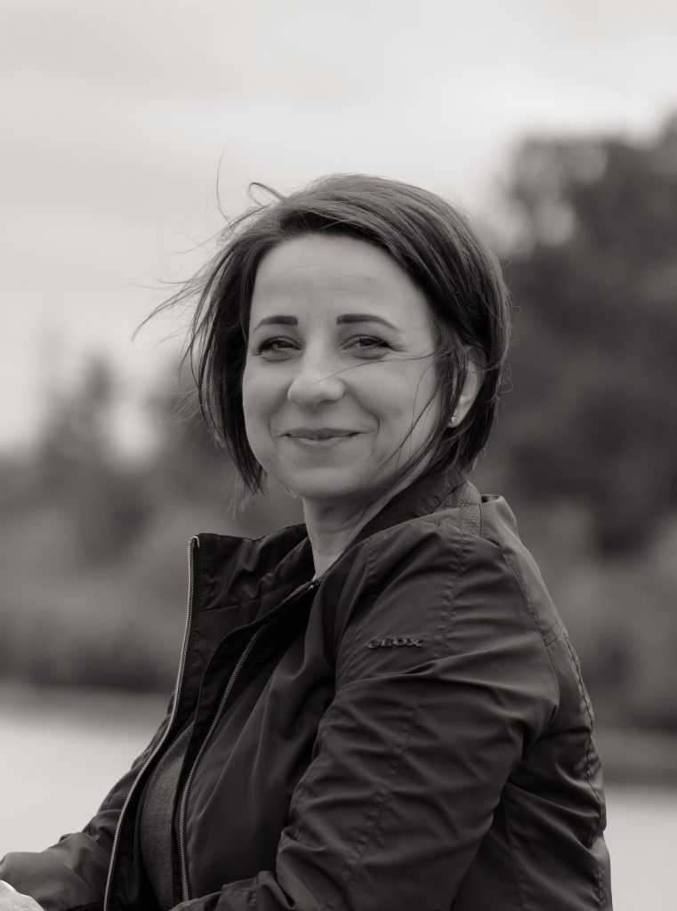 A woman smiles at the camera in London