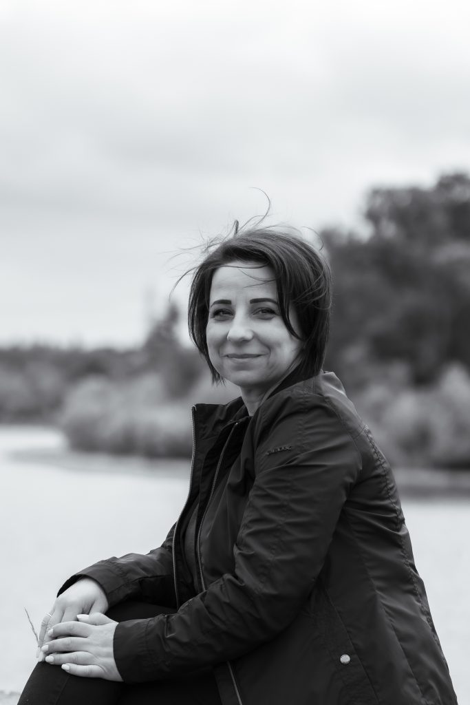 A woman smiles at the camera in London