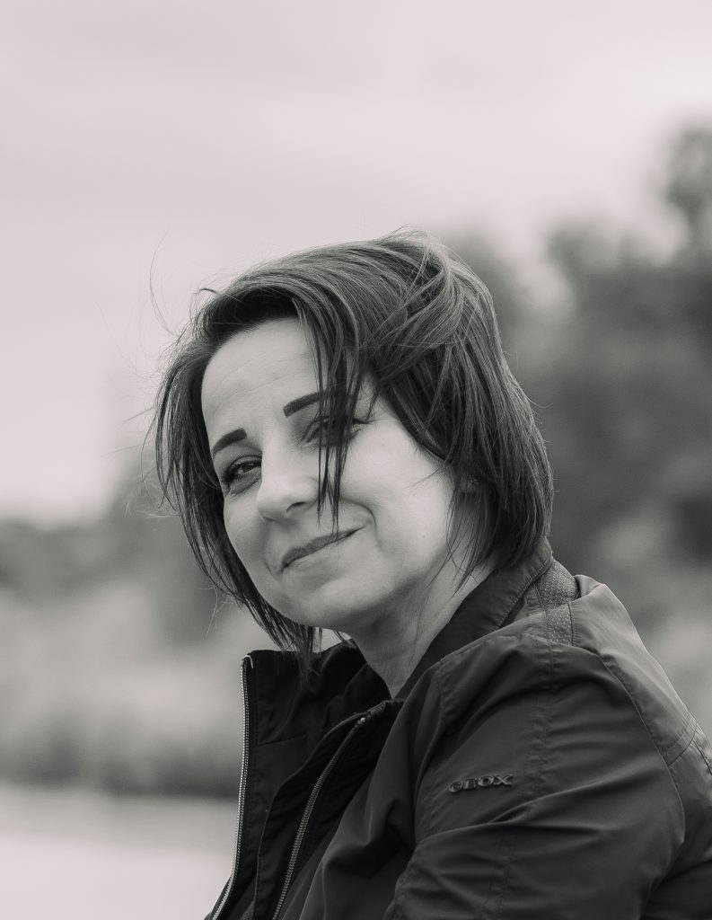 A woman smiles at the camera in London